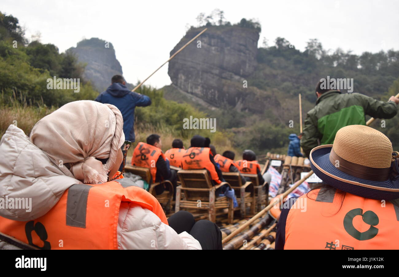 Tourists sail the Nine-bend river of Wuyishan in bamboo rafts, China Stock Photo