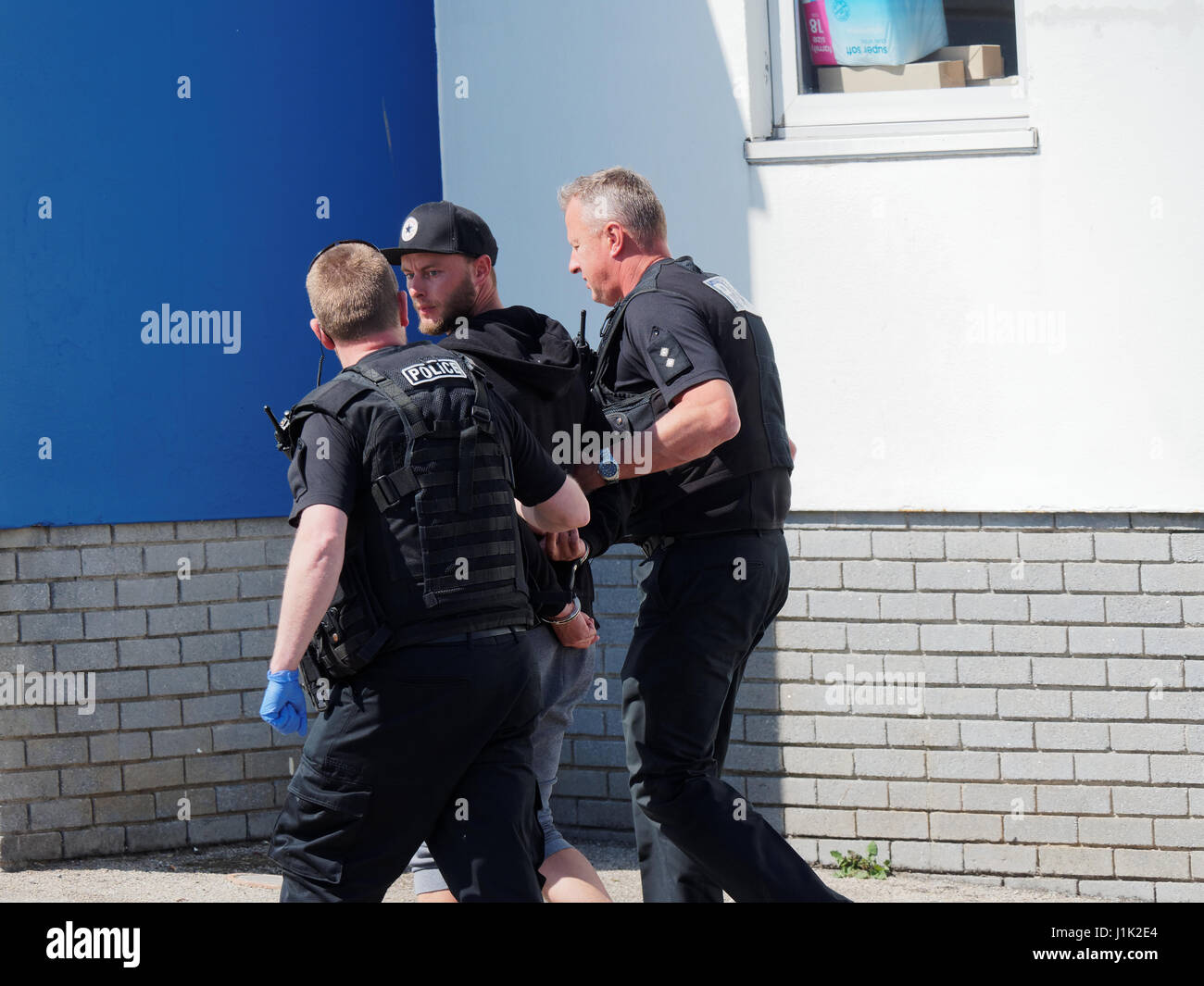 Newquay, Cornwall, .Two males escorted by police officers Credit: Robert Taylor/Alamy Live News Stock Photo