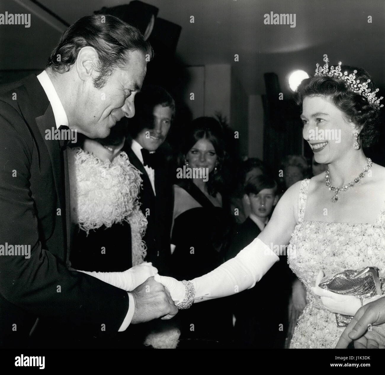 File Photo. 21st Apr, 2017. Britain's QUEEN ELIZABETH, the world's oldest and longest-reigning monarch, celebrates her 91st birthday. Pictured: Dec. 12, 1967 - The Queen meets the stars. : Queen Elizabeth II is introduced it actor Rex Harrison, star of the film ''Doctor Dolittle'' when she attended the premiere showing of the film at the Odeon Cinema, London, last night. The all-ticket showing was in aid of the British Empire Cancer Campaign Charity. (Credit Image: © Keystone Press Agency/Keystone USA via ZUMAPRESS.com) Stock Photo