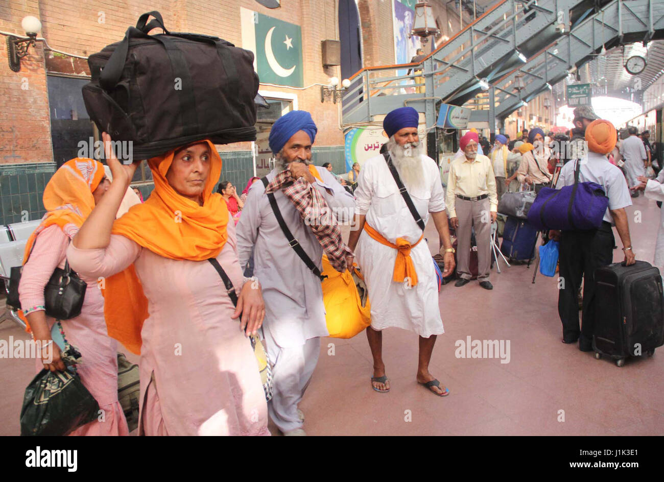 Sikh Yatri going back to India after attending Vesakhi Mela and their religious rituals in Lahore, at Lahore Junction on Friday, April 21, 2017. Stock Photo