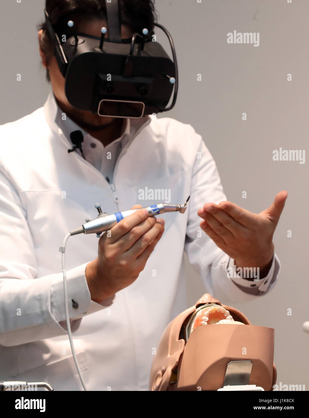 Tokyo, Japan. 21st Apr, 2017. A Japanese dentist Gaku Yoshimoto wearing a head mount display