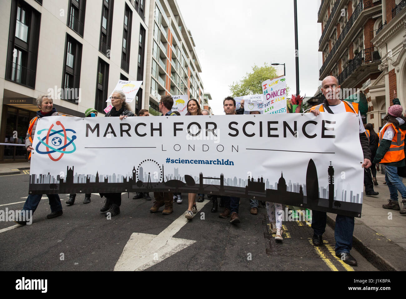 London, UK. 22nd Apr, 2017. Scientists march through central London on the ‘March for Science' as part of a global protest march in the name of science. The organisers of the march, which took place on Earth Day, stated that science is ‘under attack' from the administration of President Trump, with cuts to research funding into climate change and cancer and controversial statements by advisors such as Scott Pruitt, head of the US Environmental Protection Agency, who denied that carbon dioxide emissions are a primary cause of global warming. Credit: Mark Kerrison/Alamy Live News Stock Photo