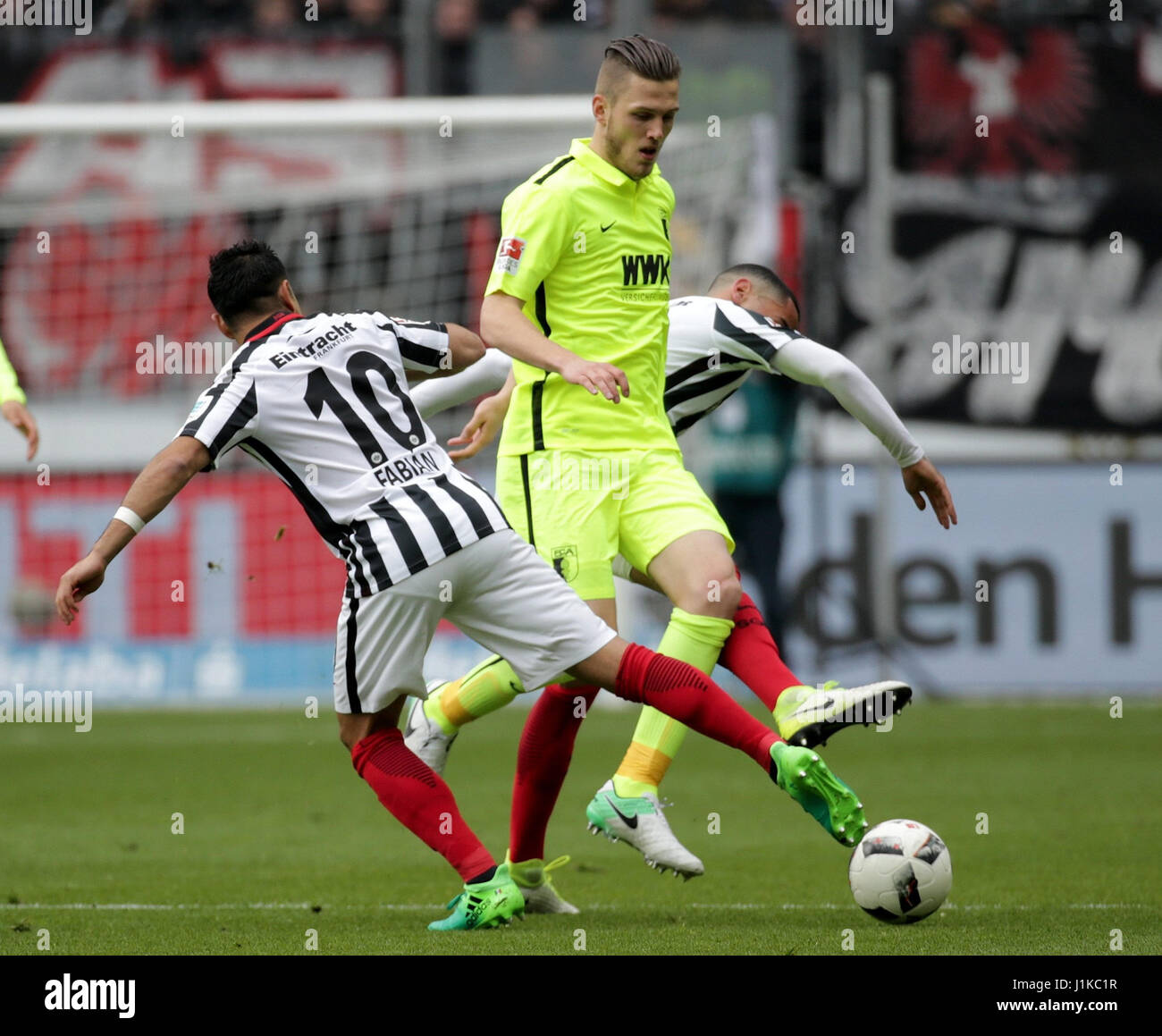 Frankfurt, Germany. 22nd Apr, 2017. Frankfurt's Marco Fabian (L) and Augsburg's Jeffrey Gouweleeuw vie for the ball during the German Bundesliga soccer match between Eintracht Frankfurt and FC Augsburg in the Commerzbank Arena in Frankfurt am Main, Germany, 22 April 2017. (EMBARGO CONDITIONS - ATTENTION: Due to the accreditation guidelines, the DFL only permits the publication and utilisation of up to 15 pictures per match on the internet and in online media during the match.) Photo: Hasan Bratic/dpa Credit: dpa picture alliance/Alamy Live News Stock Photo