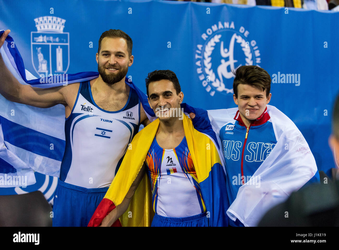 Left to right: Alexander Shatilov (ISR) - bronze medal - and Marian Dragulescu (ROU) - gold medal - and Dmitrii Lankin (RUS) silver medal during the floor Awarding Ceremony Men's Apparatus Finals at the European Men's and Women's Artistic Gymnastics Championships in Cluj Napoca, Romania. 22.04.2017 Photo: Catalin Soare/dpa Stock Photo