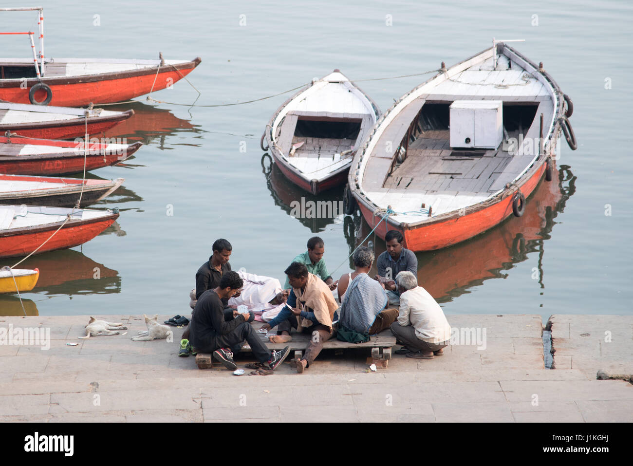 Booat men at the shore of Ganga river, Varanasi, India Stock Photo