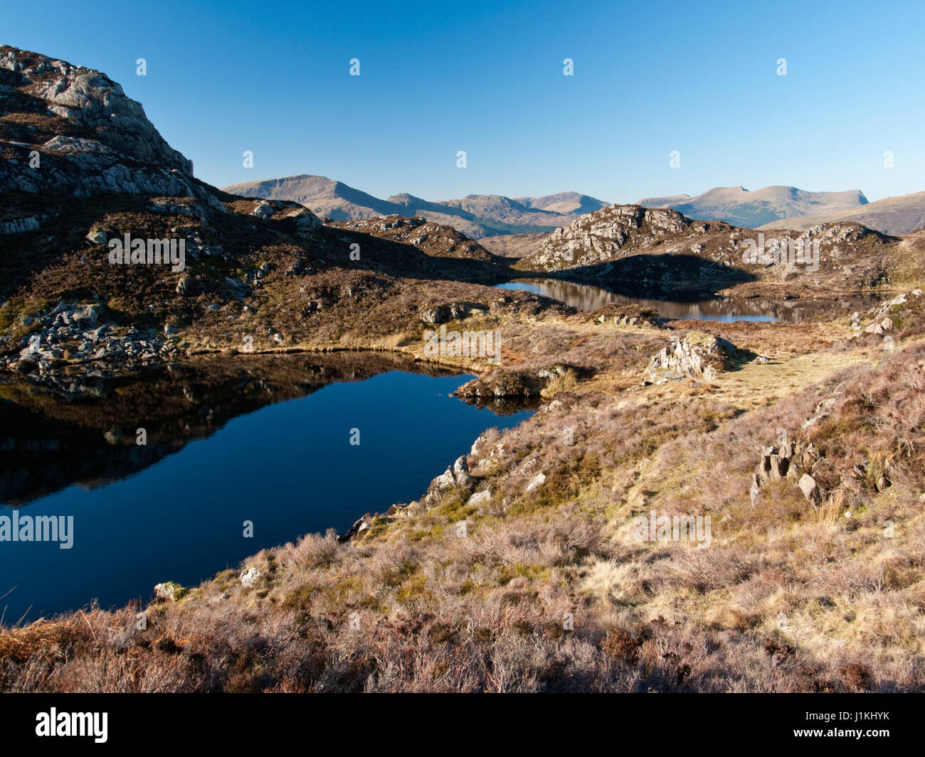 Llynnau Cerrig-y-myllt, two lakes on Yr Arddu, Nanmor near Cnicht in Snowdonia's Moelwyn mountains, with a view to Moel Hebog & the Nantlle hills Stock Photo