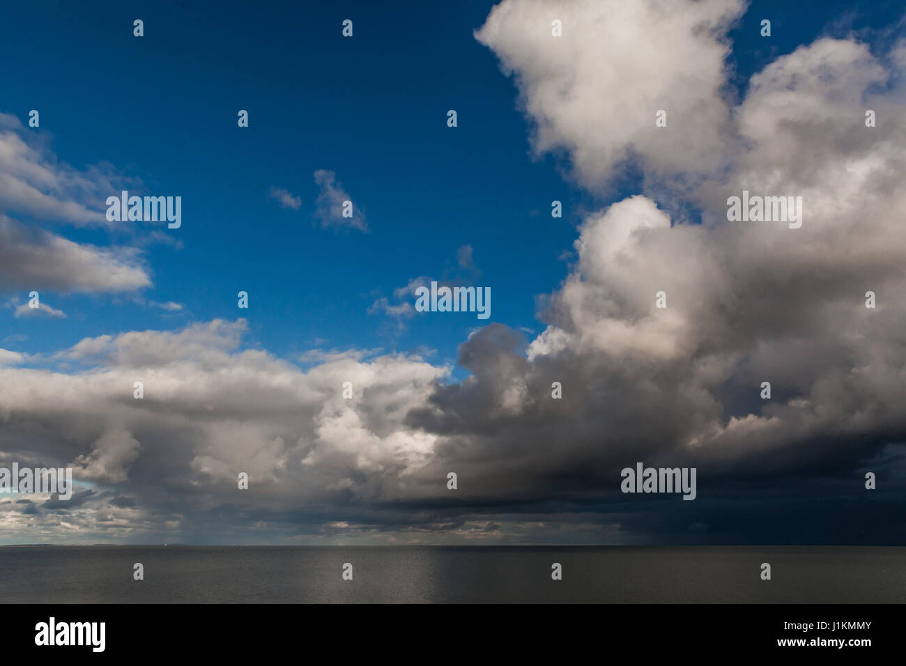 very dark sky above a very calm sea at Texel, Wadden island of the Netherlands Stock Photo