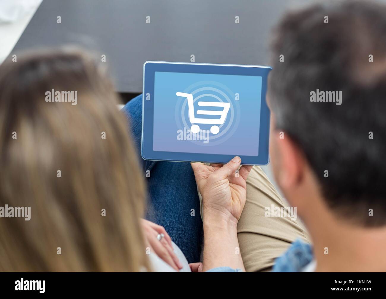 Digital composite of People using Tablet with Shopping trolley icon ...