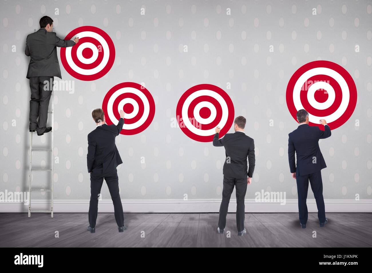 Full Person Rear View Target Digital composite of Full length rear view of businessmen setting ...