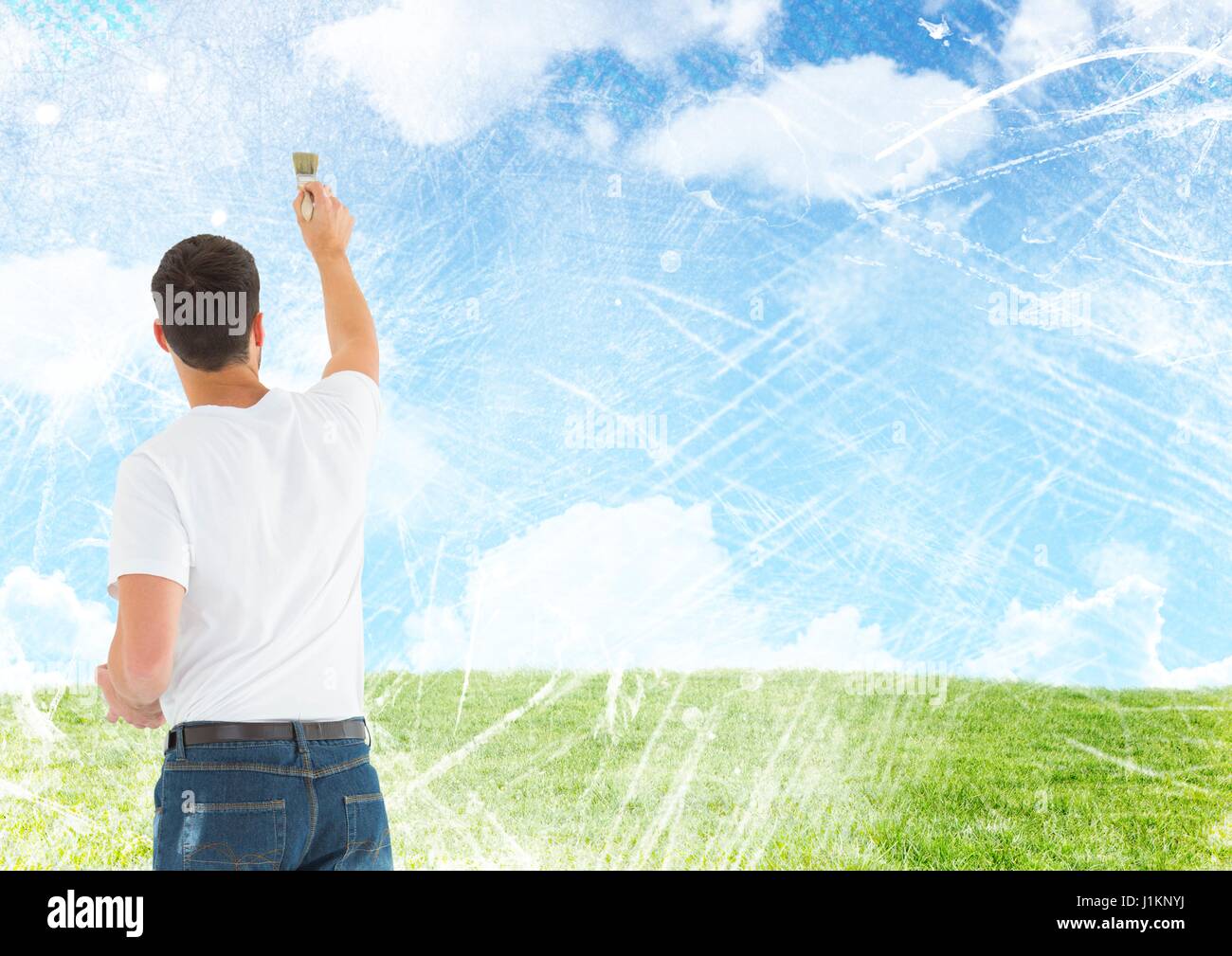 Digital composite of Man painting blue sky clouds Stock Photo - Alamy