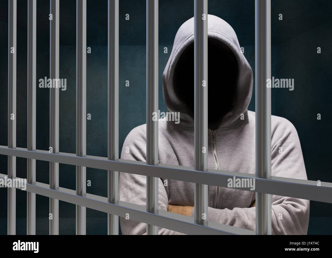 Digital composite of Anonymous Criminal in hood behind prison bars