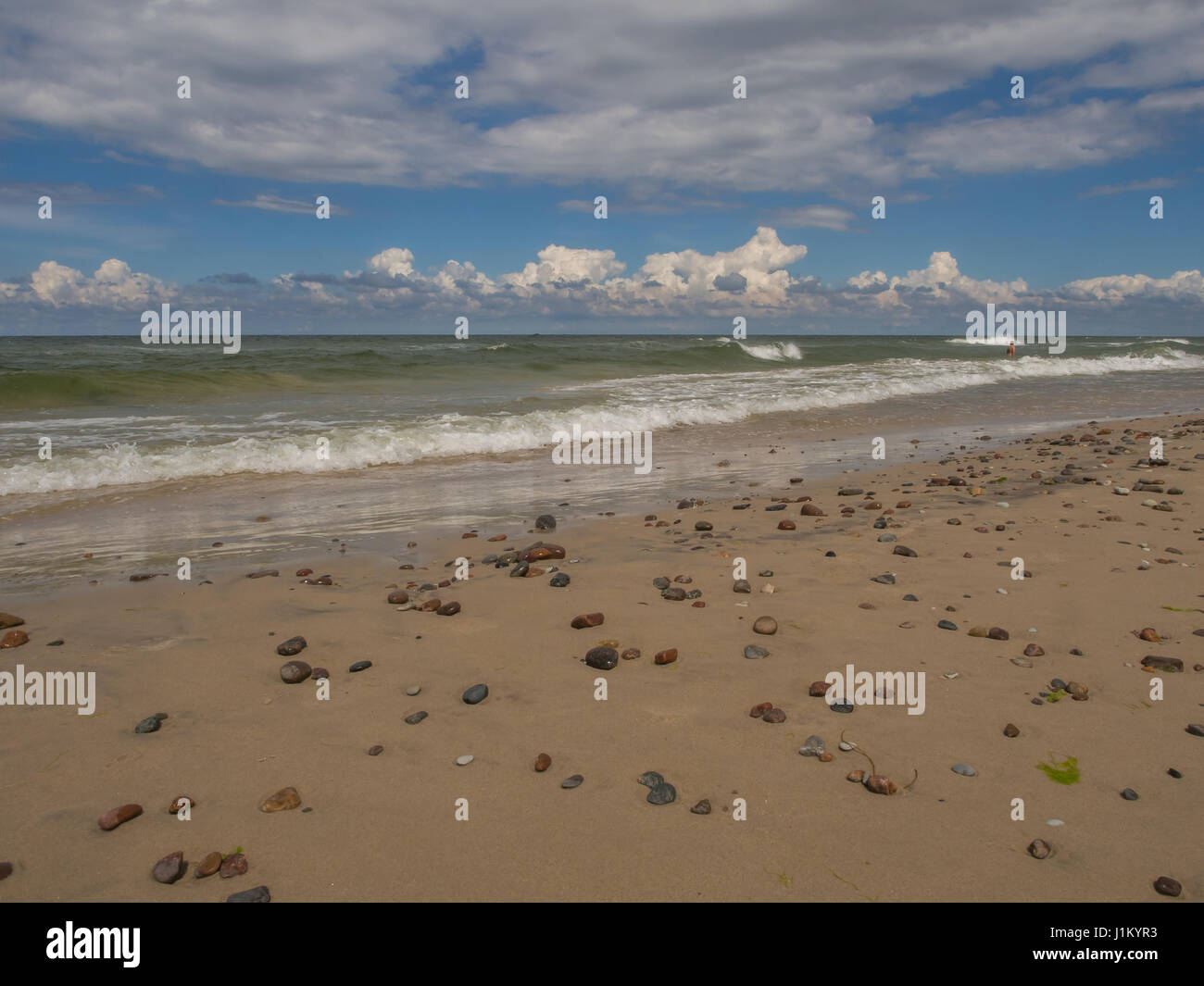 Sand beach and small stones on a shore of the Baltic Sea Stock Photo