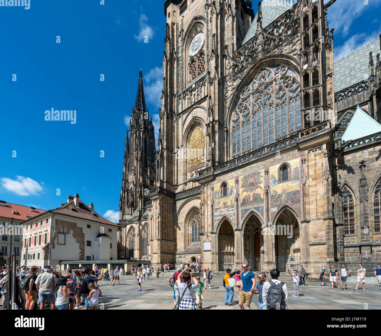 The southern facade of St Vitus Cathedral showing the Golden Gate and its mosaic of the Resurrection, Prague Castle, Prague, Czech Republic Stock Photo