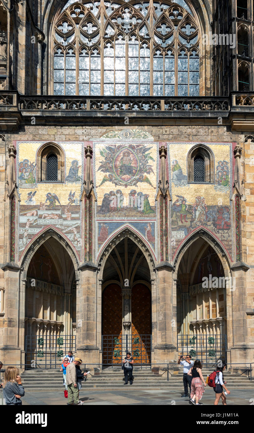 The southern facade of St Vitus Cathedral showing the Golden Gate and its mosaic of the Resurrection, Prague Castle, Prague, Czech Republic Stock Photo