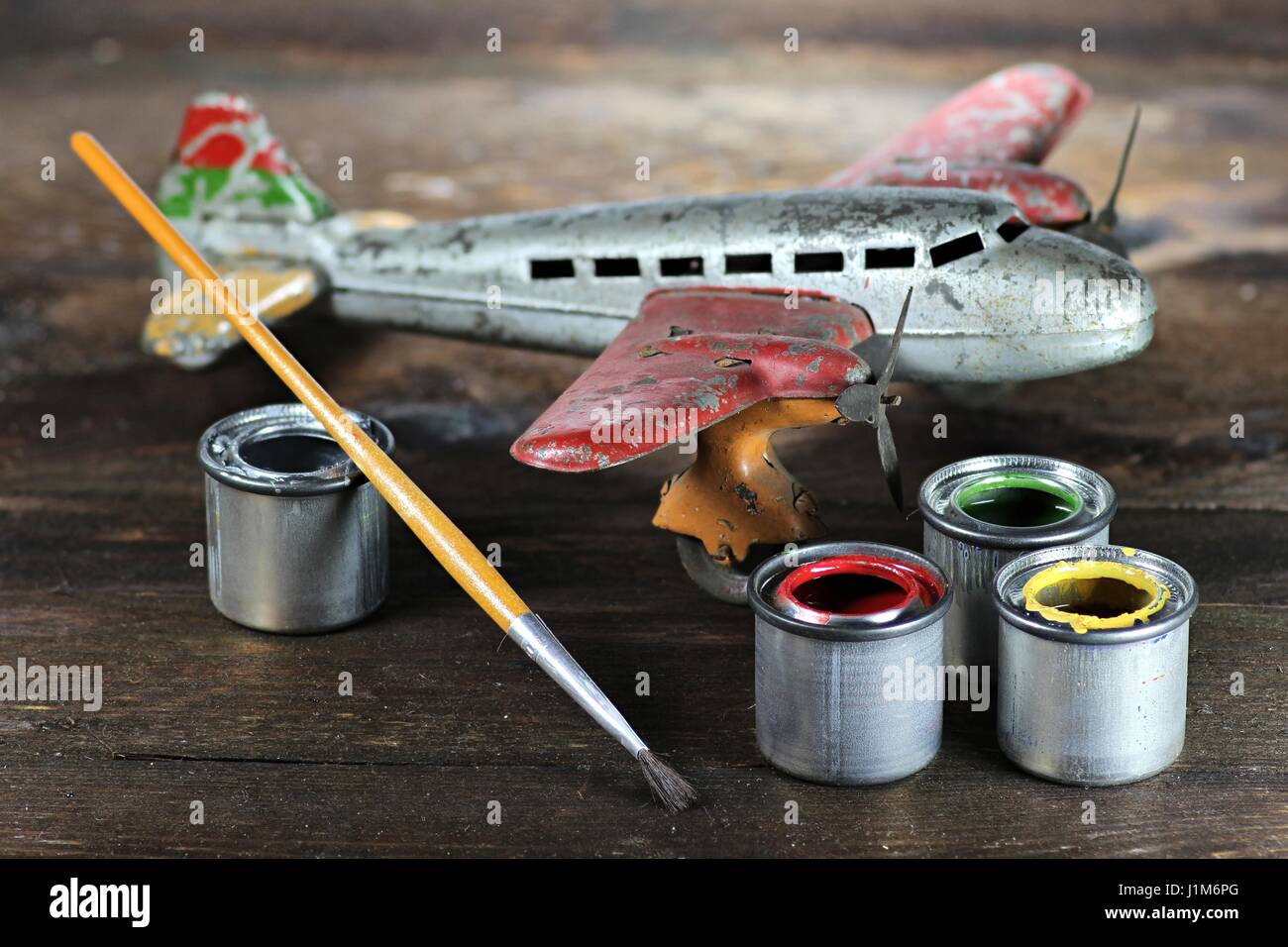 antique tin toy plane under restoration Stock Photo