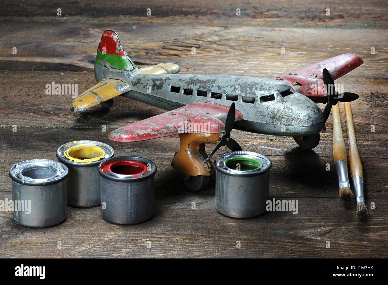 antique tin toy plane under restoration Stock Photo