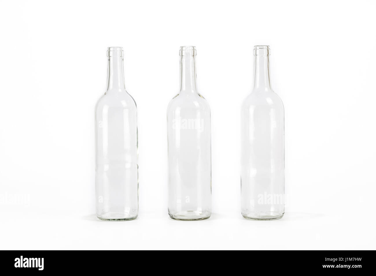 Three empty glass bottle isolated on white background Stock Photo Alamy