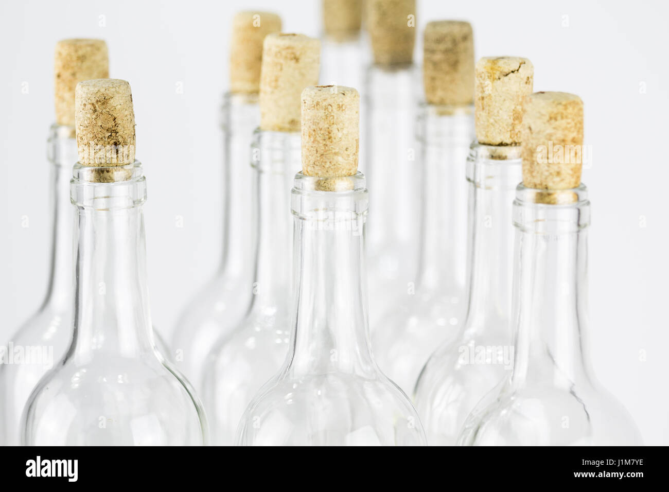 Group of empty glass bottle with cork isolated on white background Stock Photo