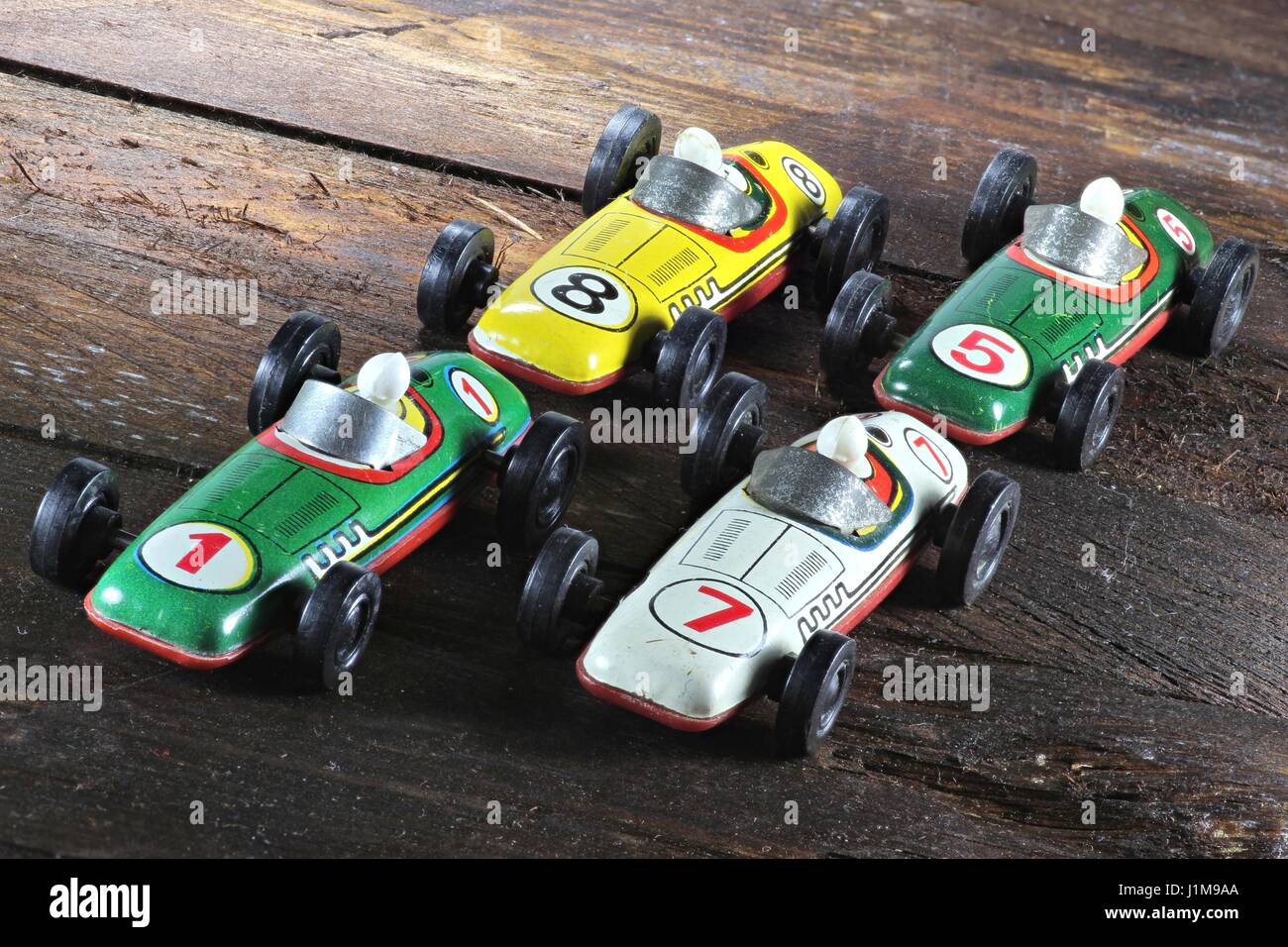 old model racers on wooden background Stock Photo