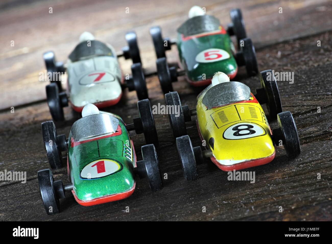 old model racers on wooden background Stock Photo