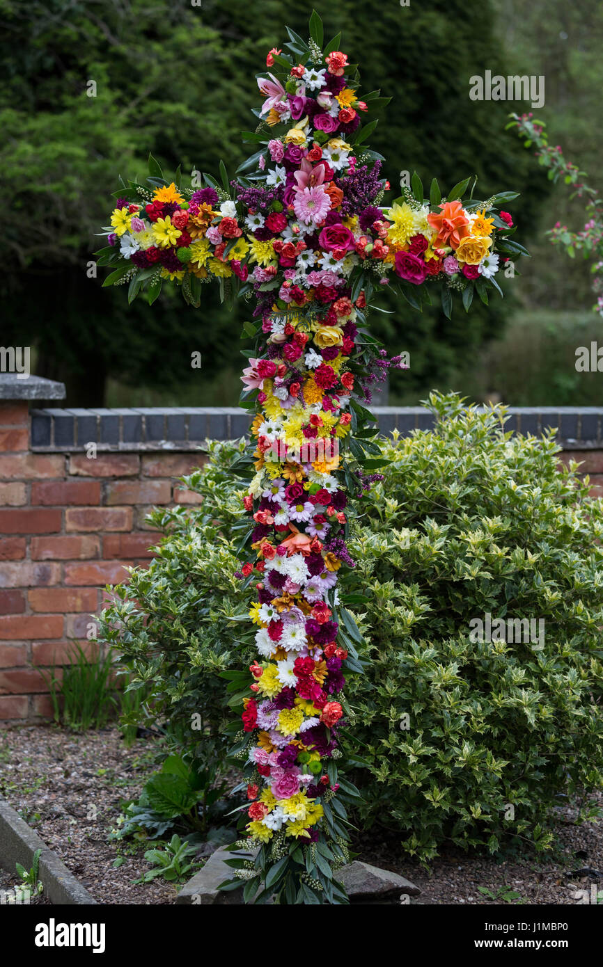 Easter Cross decorated with flowers by the congregation Stock Photo