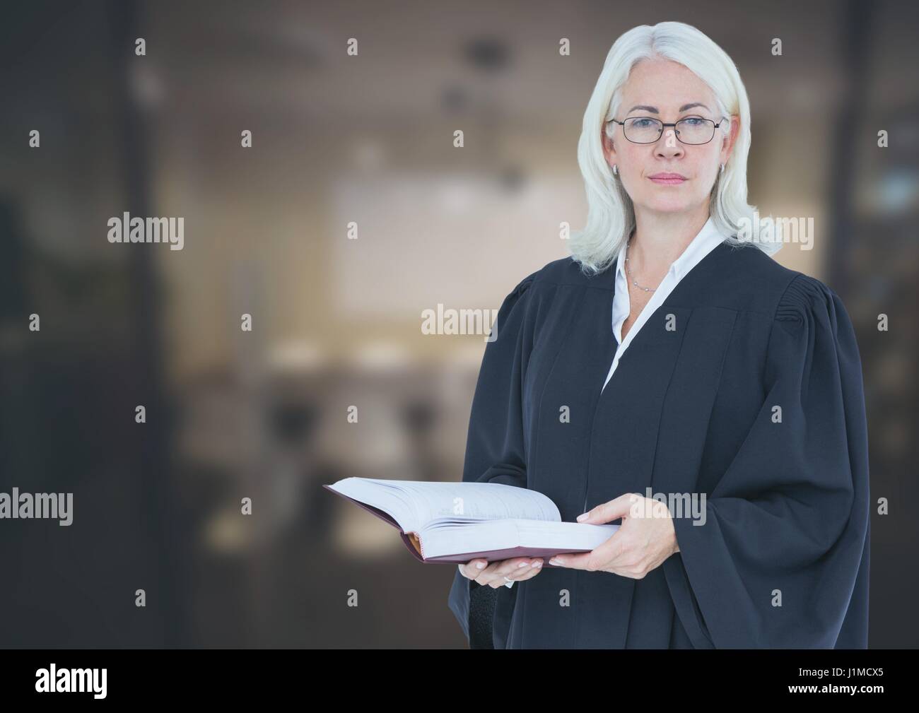 Digital composite of Judge holding book in front of office Stock Photo
