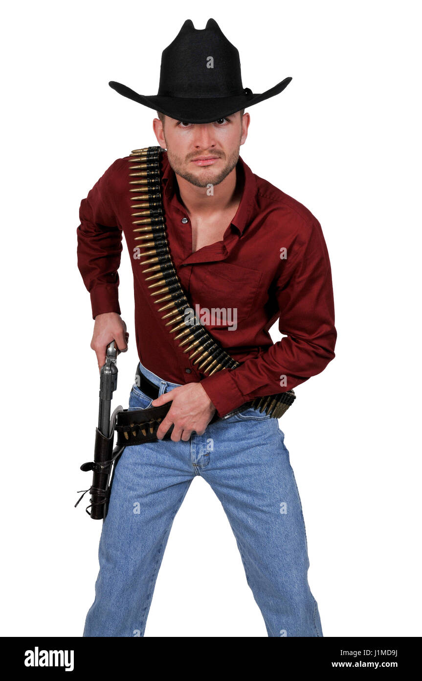 Handsome cowboy man with six shooter guns Stock Photo