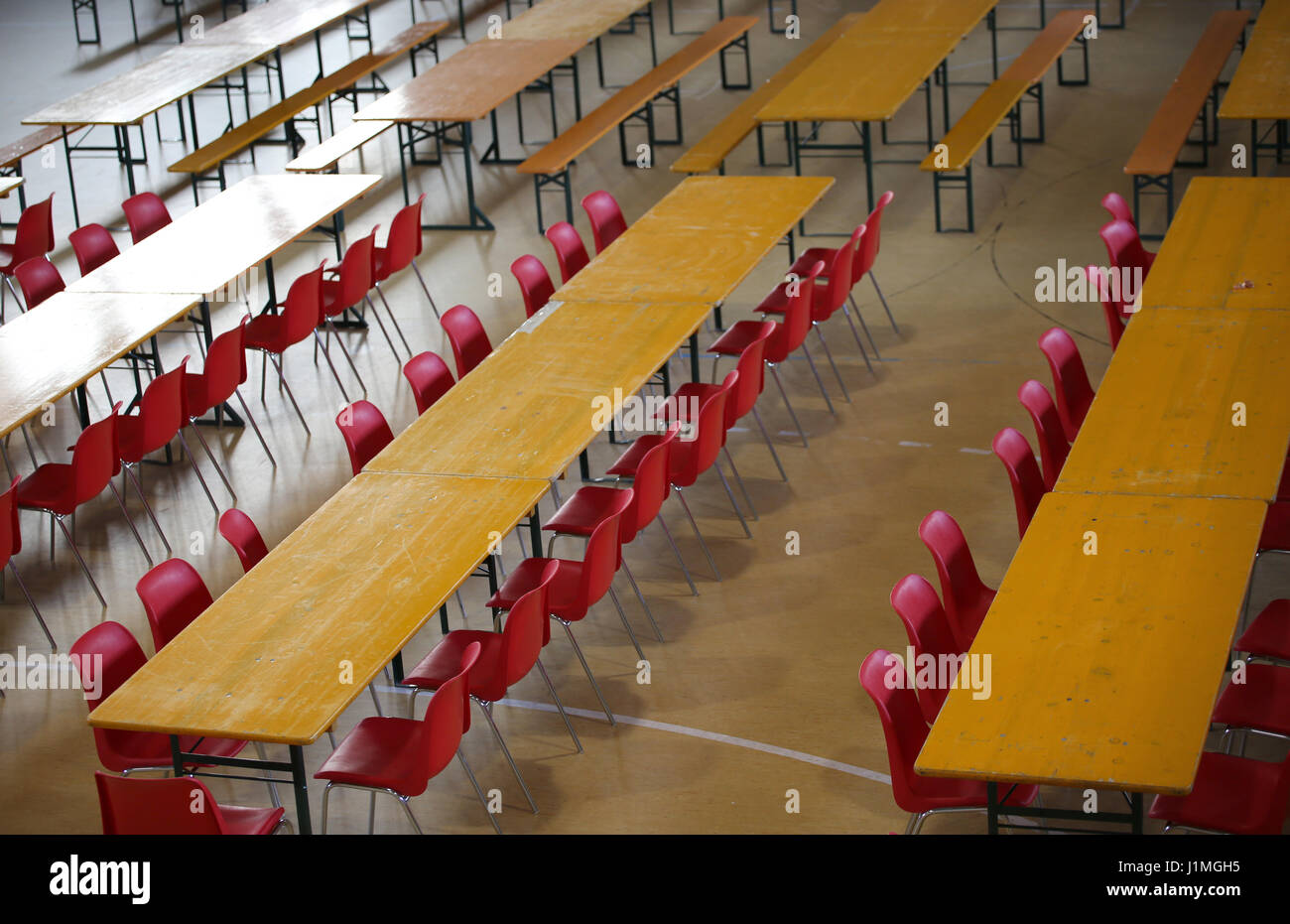Table With Red Chairs In A Wide Lunch Room In A School Stock