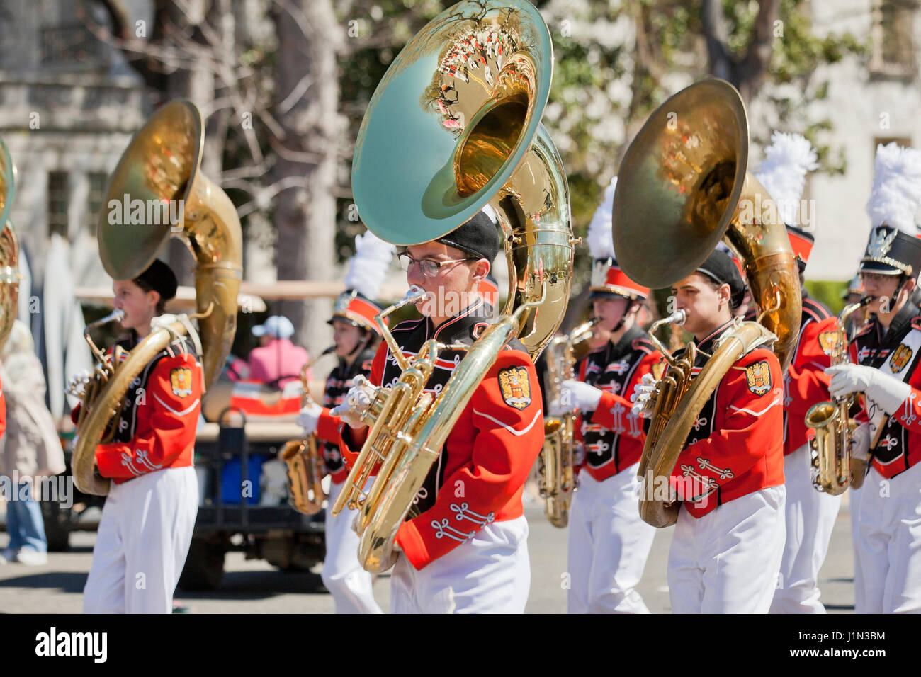 High school marching band sousaphone players during street parade USA