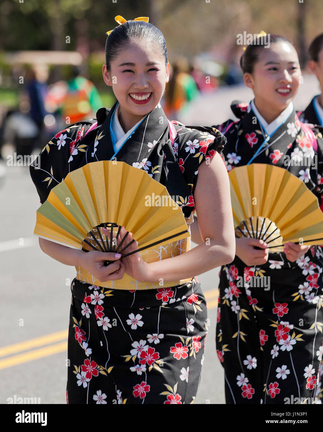 Young Japanese girls marching in the National Cherry Blossom Festival