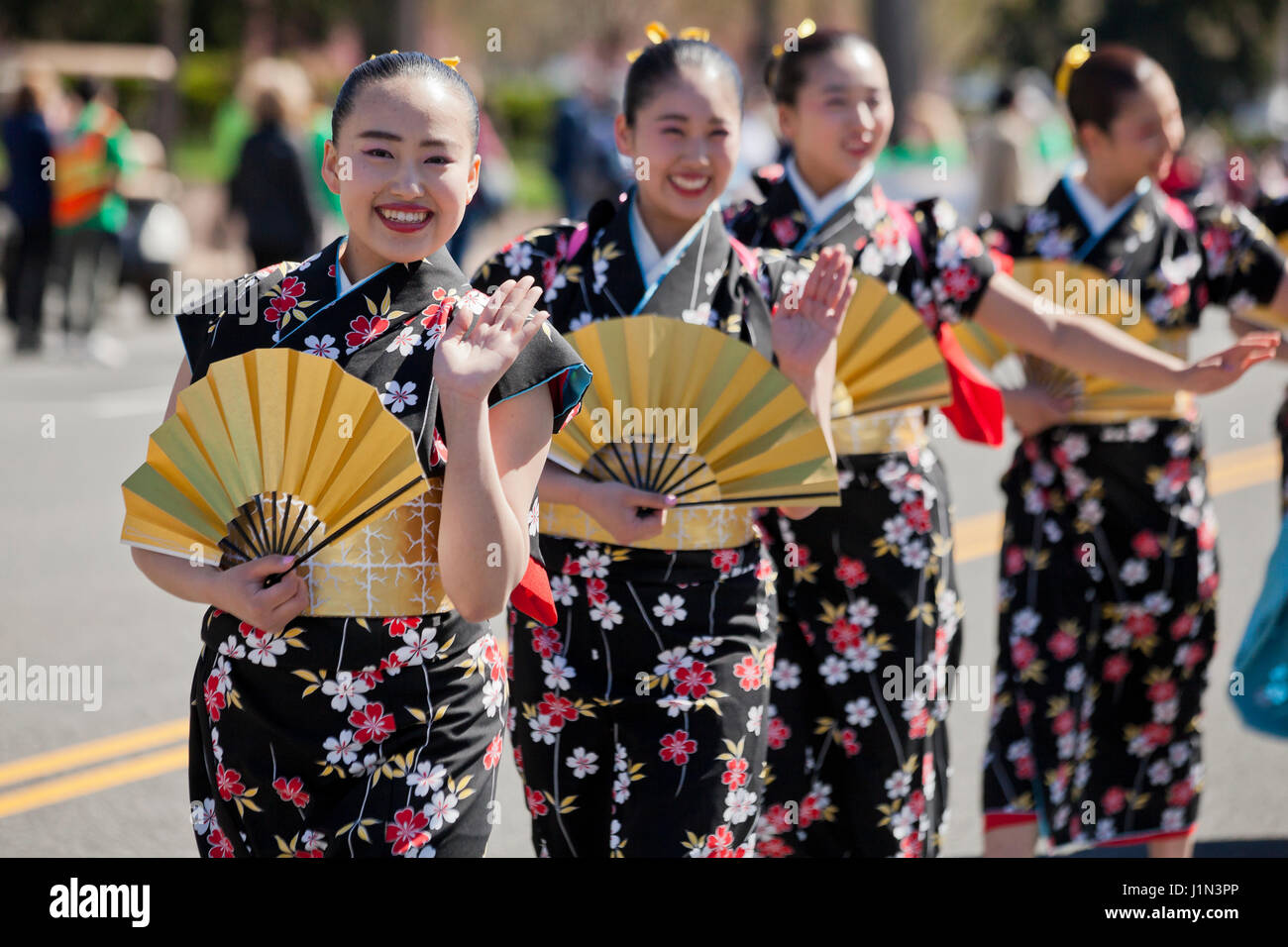 Young Japanese girls marching in the National Cherry Blossom Festival