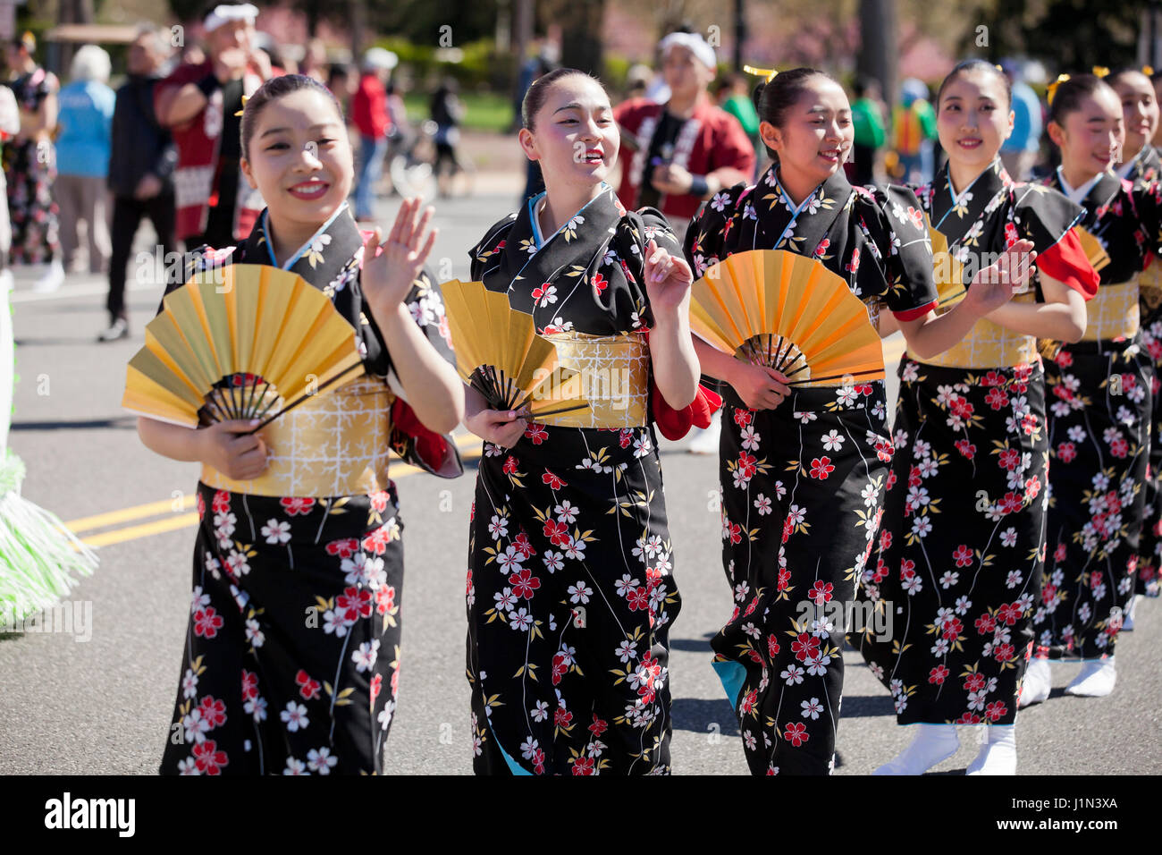 Young Japanese girls marching in the National Cherry Blossom Festival parade - Washington, DC USA Stock Photo