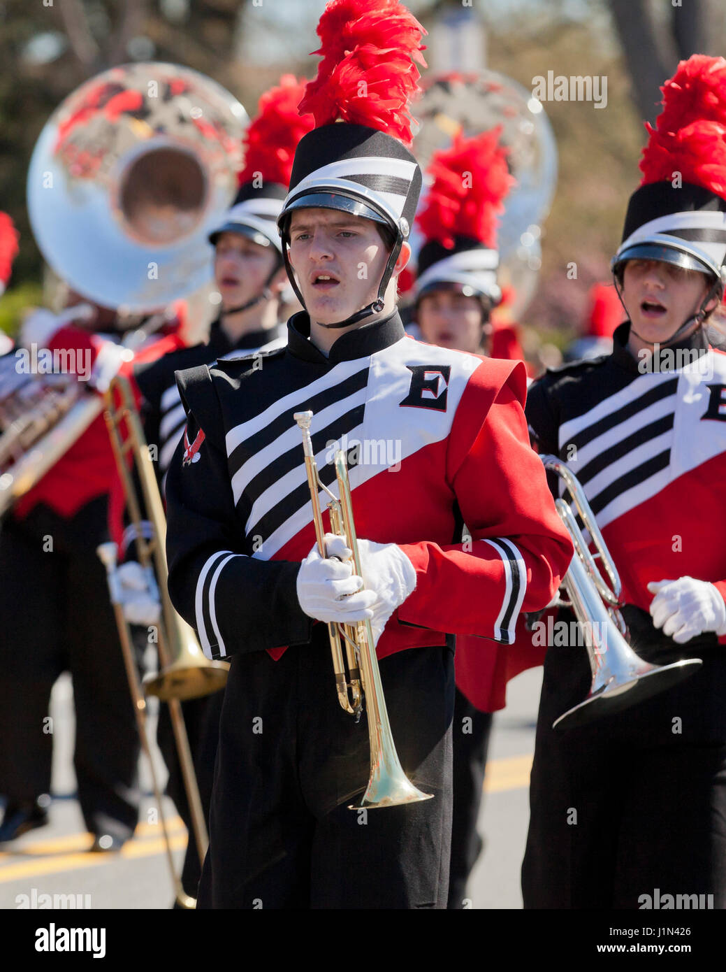 High school marching band trumpet player during parade - USA Stock Photo