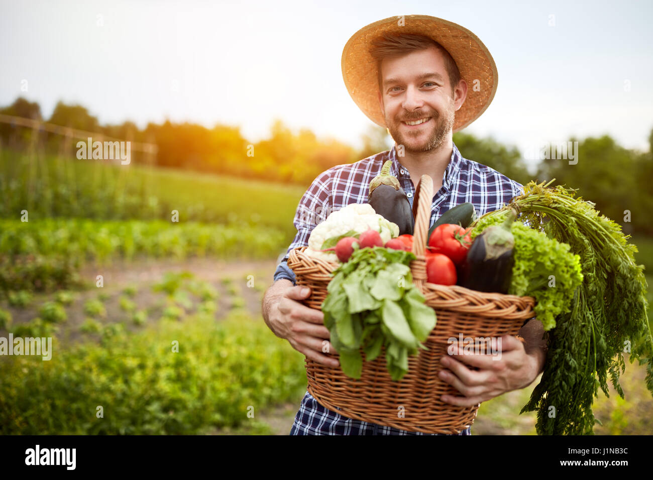 Young man vegetables basket hi-res stock photography and images - Alamy
