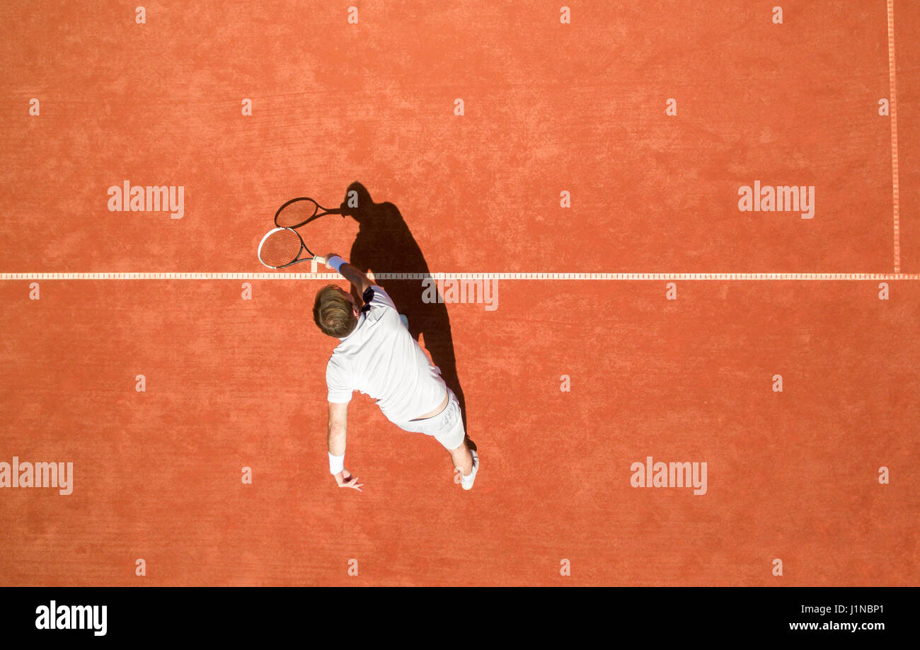 Top view of male tennis player in action Stock Photo