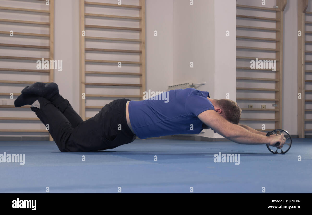 One Young Man Only Muscular Exercise Ab Abs Roller Floor Stock