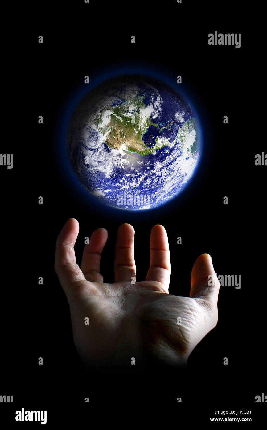 God holding the world in his hands hires stock photography and images