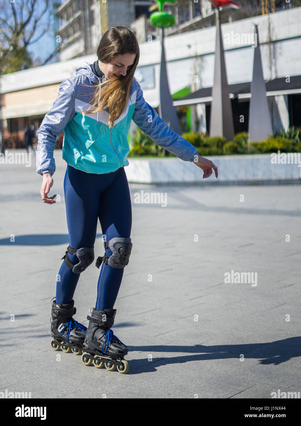 Beautiful Roller Girl is learning how to skate Stock Photo Alamy