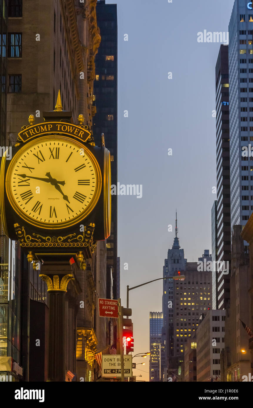 New York, USA - December 4, 2011: Trump Tower Clock and the Empire State Building at the evening from the street in Manhattan in New York City Stock Photo