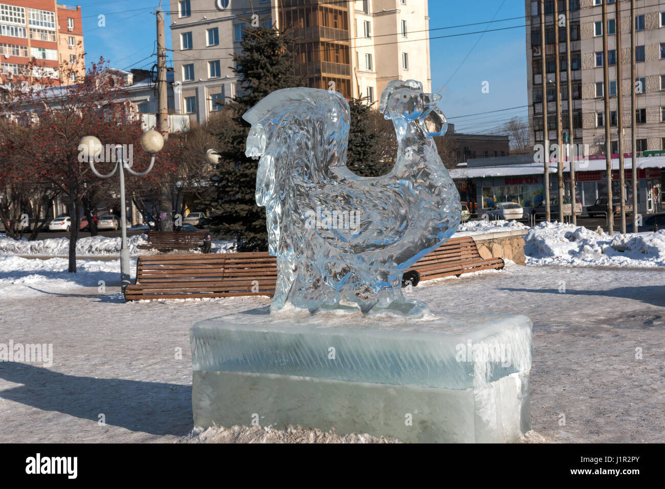 rooster sculpture made of ice in the recreational park Stock Photo