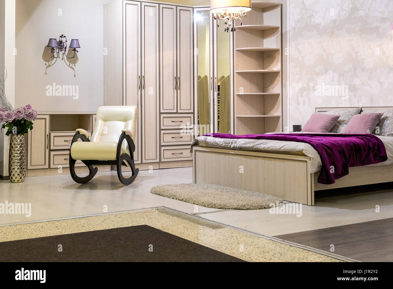 bedroom with a bed, a wardrobe, desk and chair Stock Photo Alamy