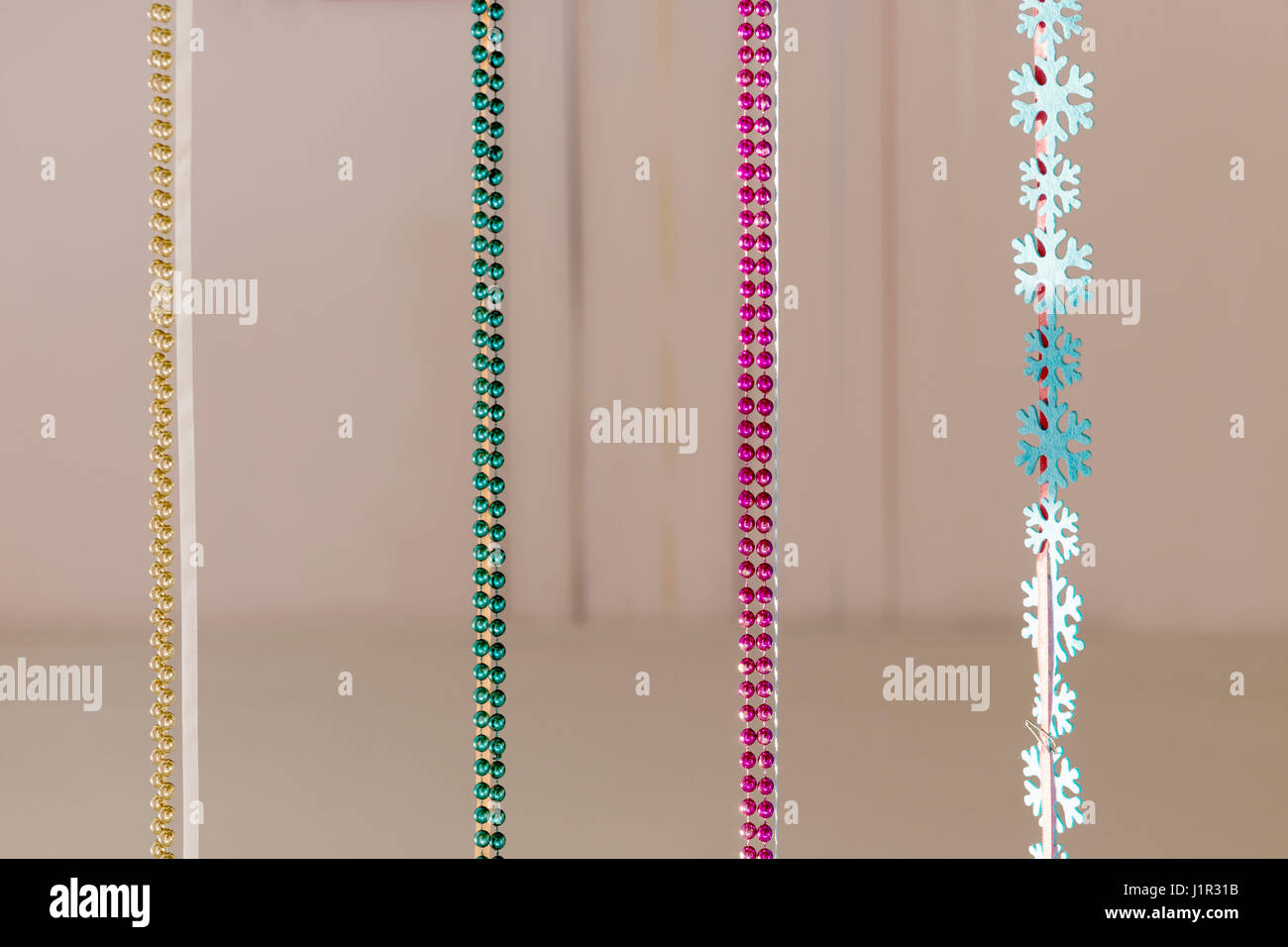 Christmas decoration colored beads hanging vertically Stock Photo
