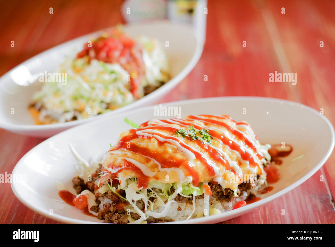 Okonomiyaki Japanese pancakes on white dish Stock Photo Alamy