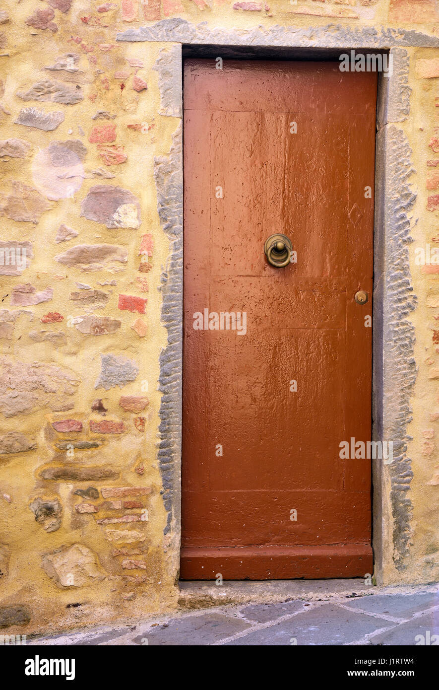 old wooden door and stone wall Stock Photo - Alamy