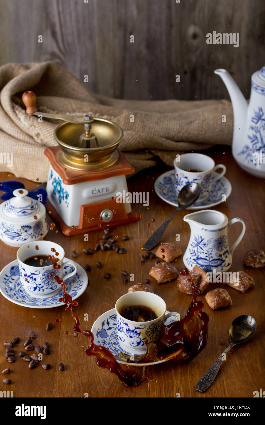 An ancient coffee set with hot coffee in a rustic style, splash Stock ...