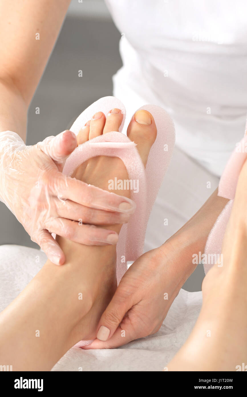 Pedicure and foot massage Foot massage in the spa salon Foot massage