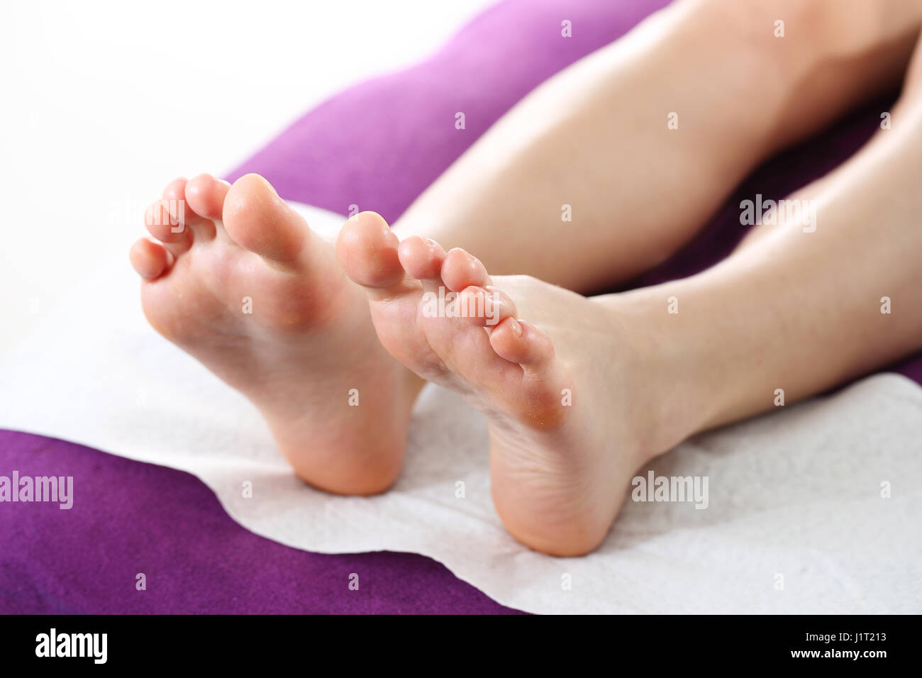 Beautiful feet. Pedicure. Hygiene of fingernails at the feet. Nail care