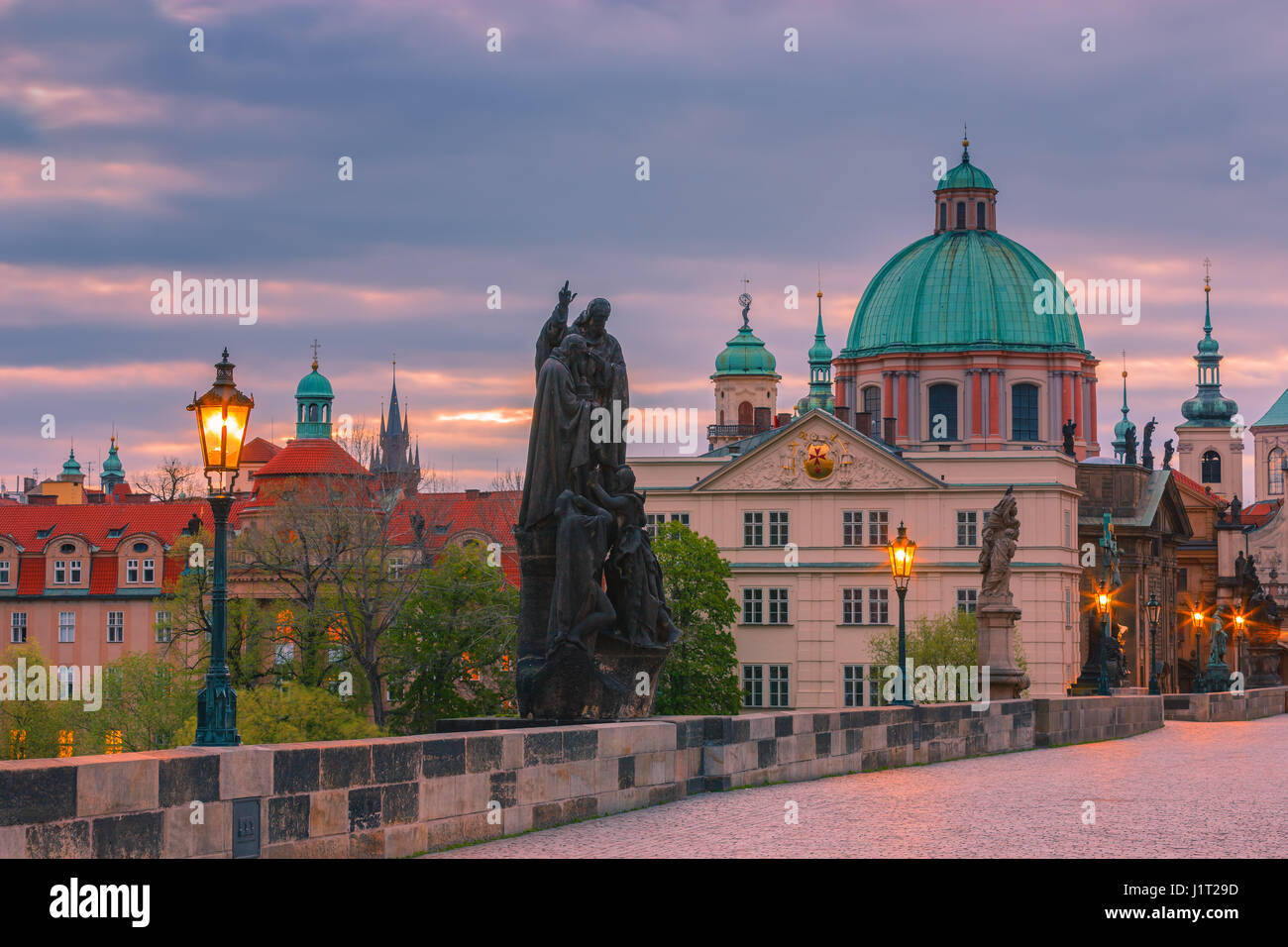 The famous Charles Bridge at sunrise in Prague in the Czech Republic Stock Photo