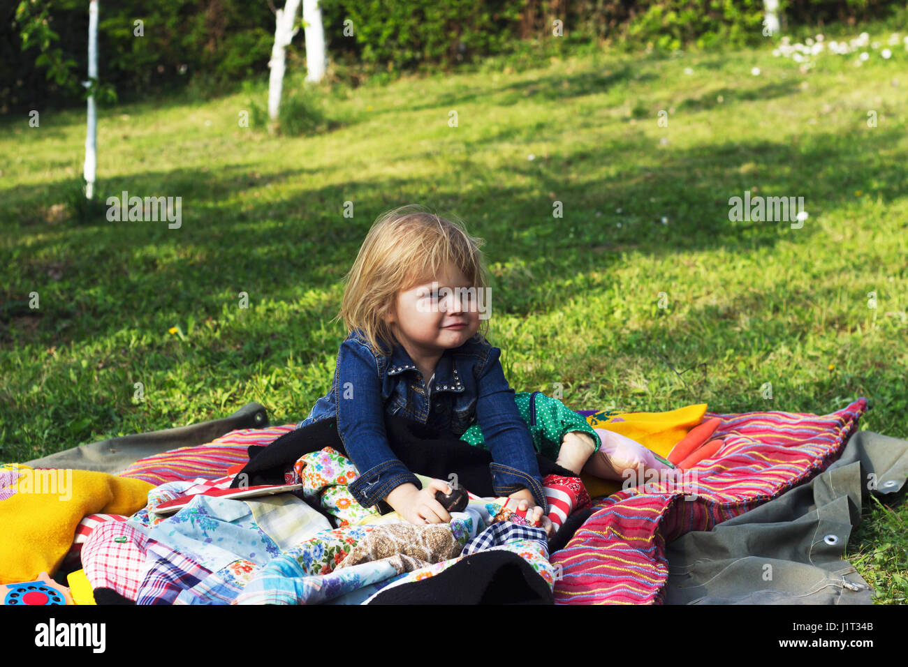 Toddler girl enjoys picnic Stock Photo Alamy