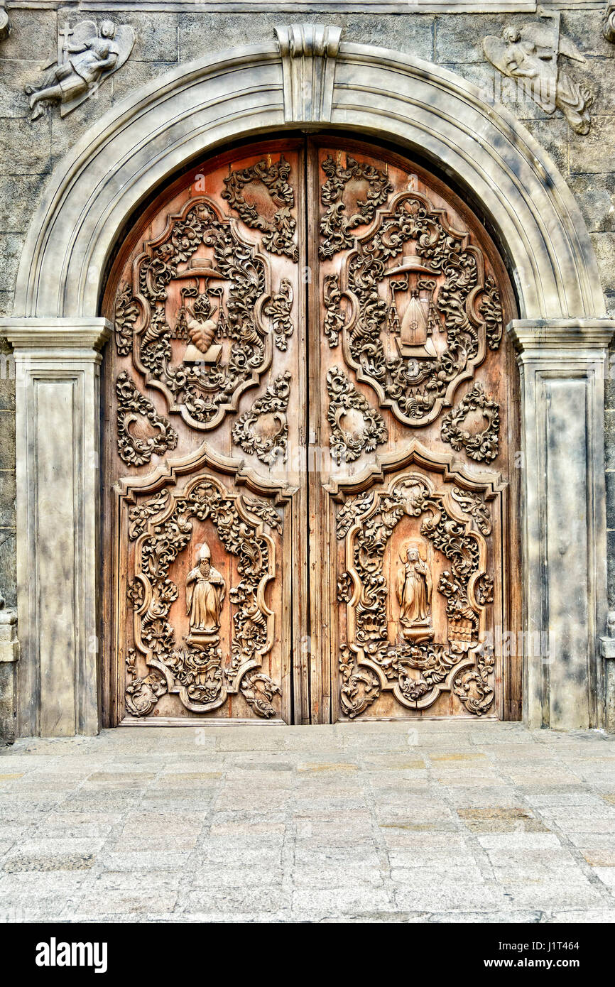 Old and intricately carved wooden Catholic Church door Stock Photo - Alamy